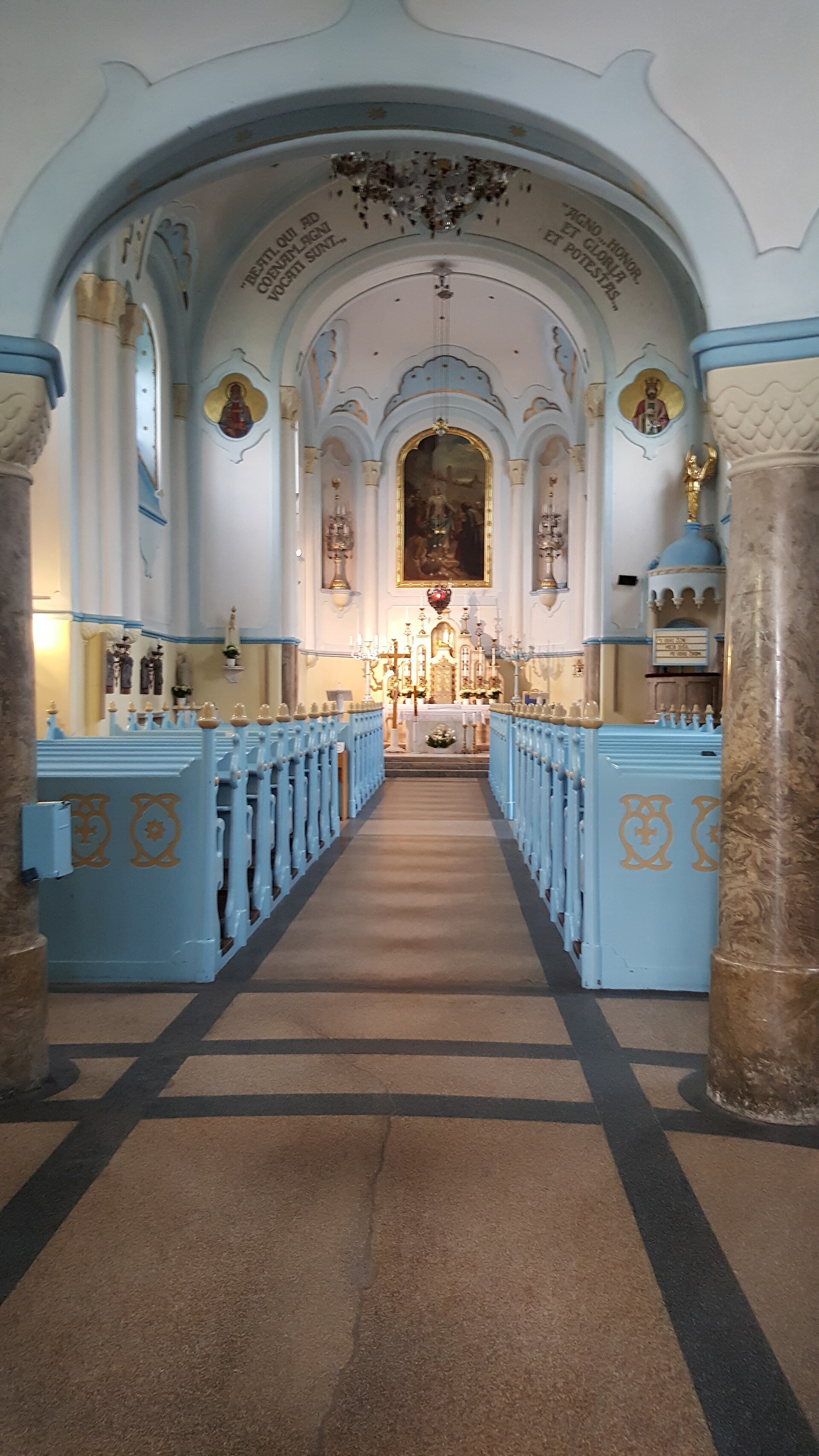Nave of the Blue Church of Saint Elizabeth in Bratislava, pale blue vault and pews